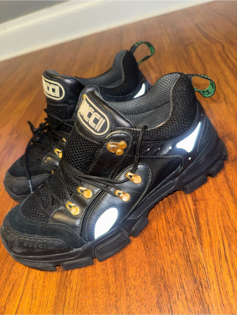 Gucci Black Sneakers with Gold Eyelets and Green Heel Tabs